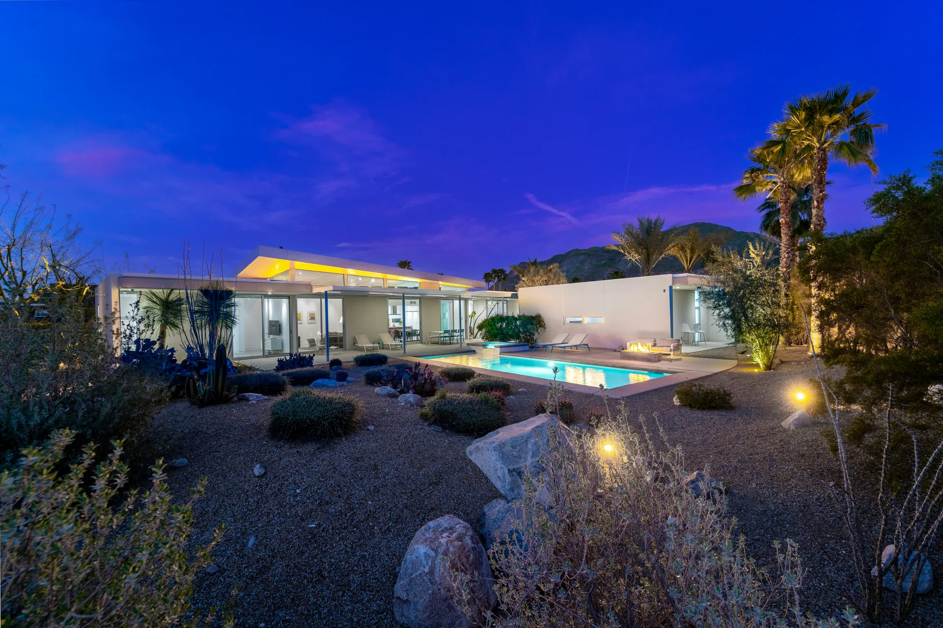 Twilight scene with cactus and pool in the foreground
